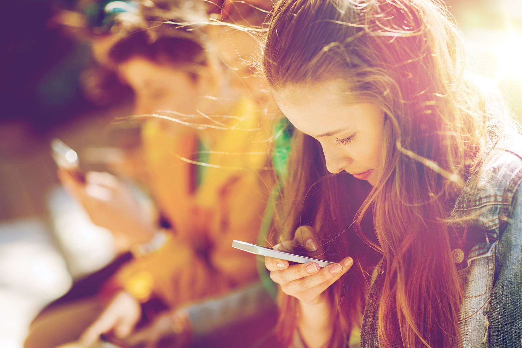 millennials gen y and z teenagers on smartphones